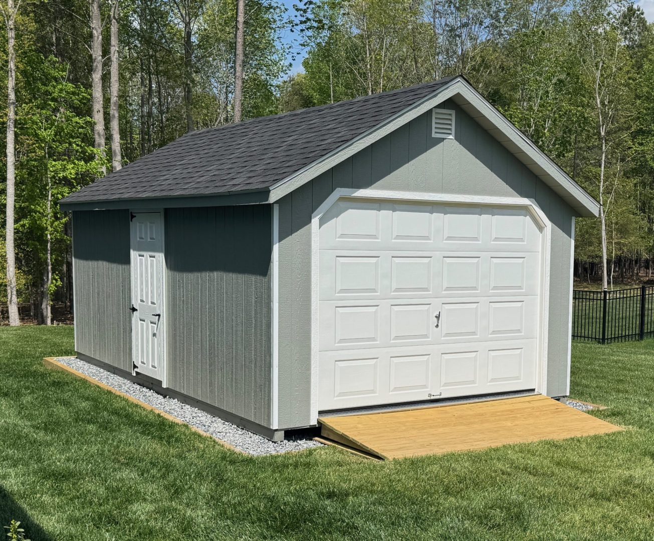 A compact shed with a door and a window, surrounded by greenery.